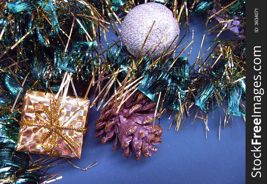 Little box, Christmas ball and pine cone with Christmas chains. Little box, Christmas ball and pine cone with Christmas chains