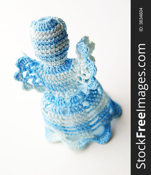 Blue-white christmas crochet angel. Christmas decorations on a white background