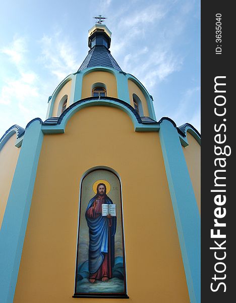 Front of modern little Christian church chapel with fresco. Front of modern little Christian church chapel with fresco