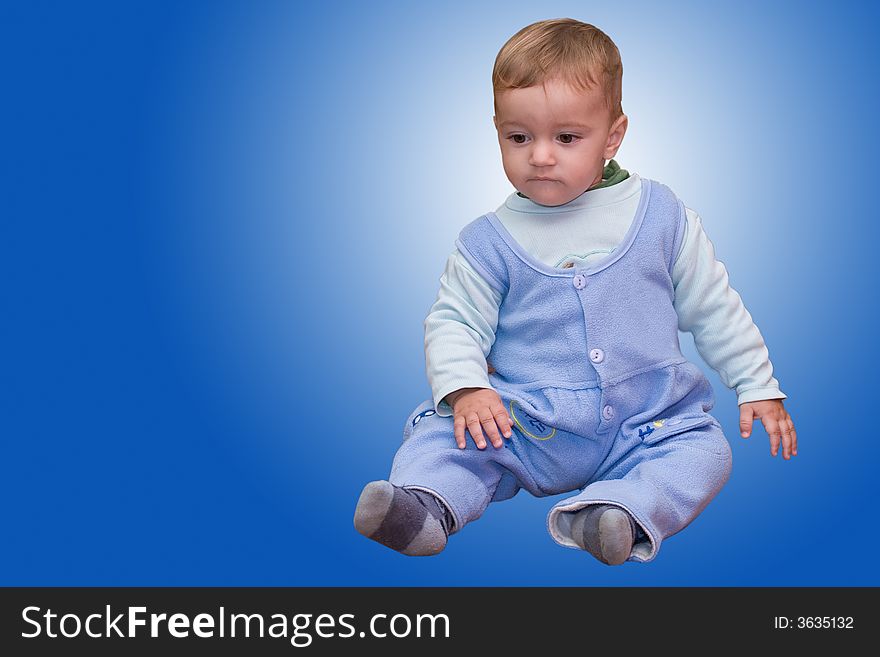 Cute young boy isolated on blue (with clipping path). Cute young boy isolated on blue (with clipping path)