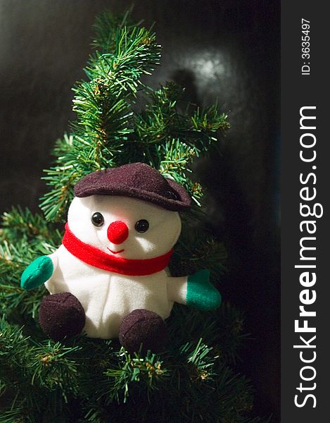 A santa claus puppet in a christmas tree