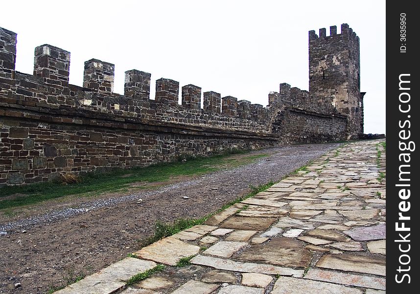 Tower, wall and road of an old Byzantian fortress in the Sudak in Crimea. Tower, wall and road of an old Byzantian fortress in the Sudak in Crimea.