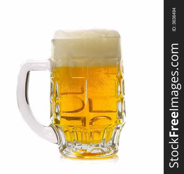Fresh golden beer in a mug on a white background