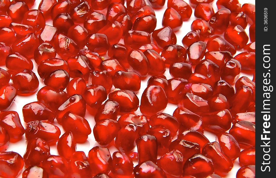 Ripe pomegranate on a white background