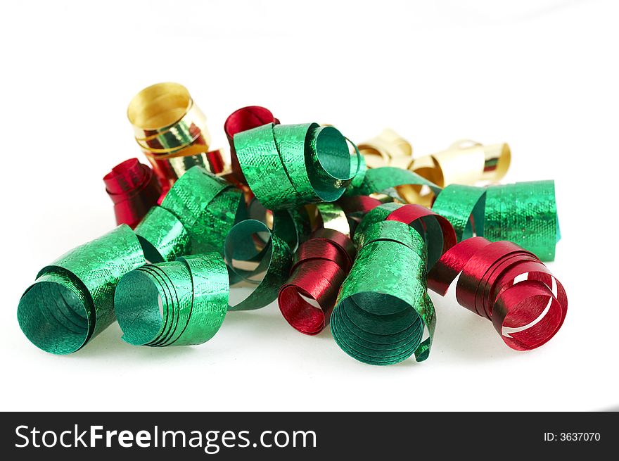 Green, red, and gold present ribbon on white. Green, red, and gold present ribbon on white