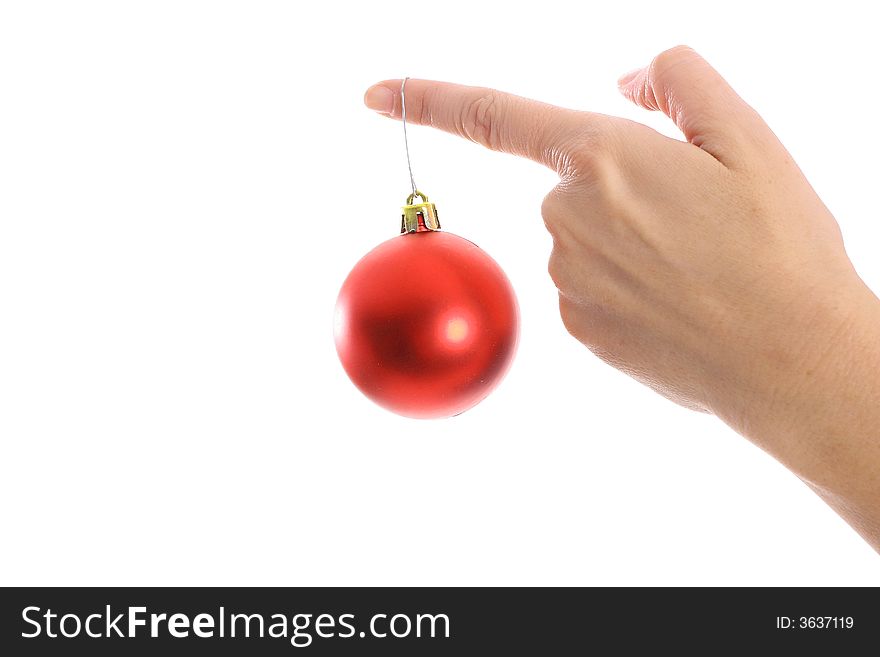 Shot of an ornament hanging on womans finger. Shot of an ornament hanging on womans finger