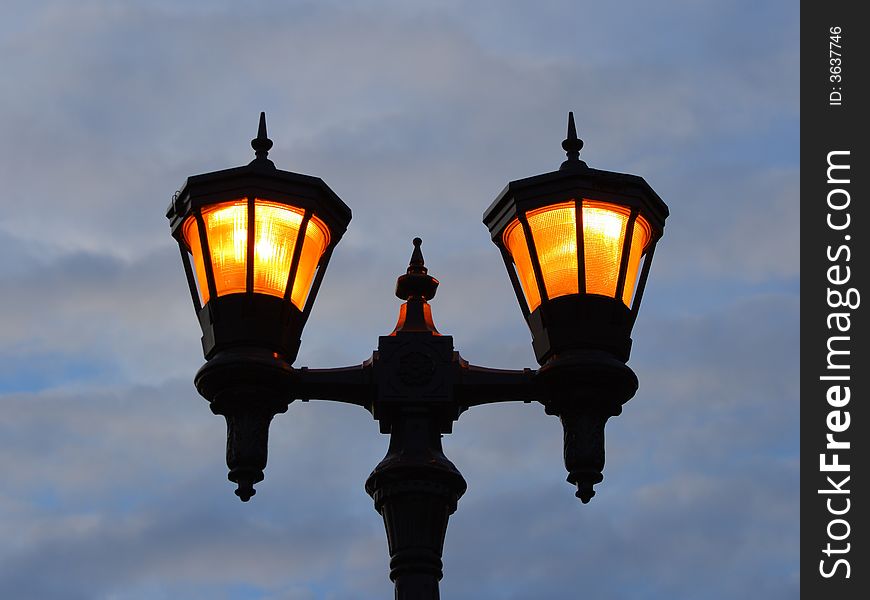 Retro street post with lighted two lamps in Saint Paul, Minnesota