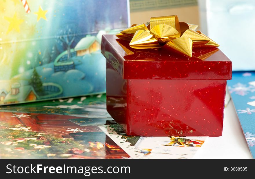 An image of red box with present. An image of red box with present