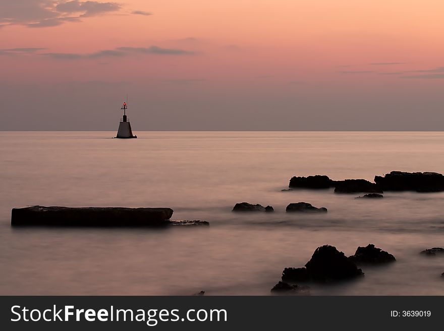 Lighthouse on sea at night