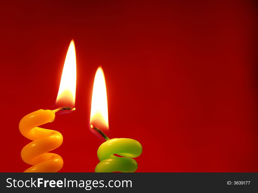 Candle on a red background