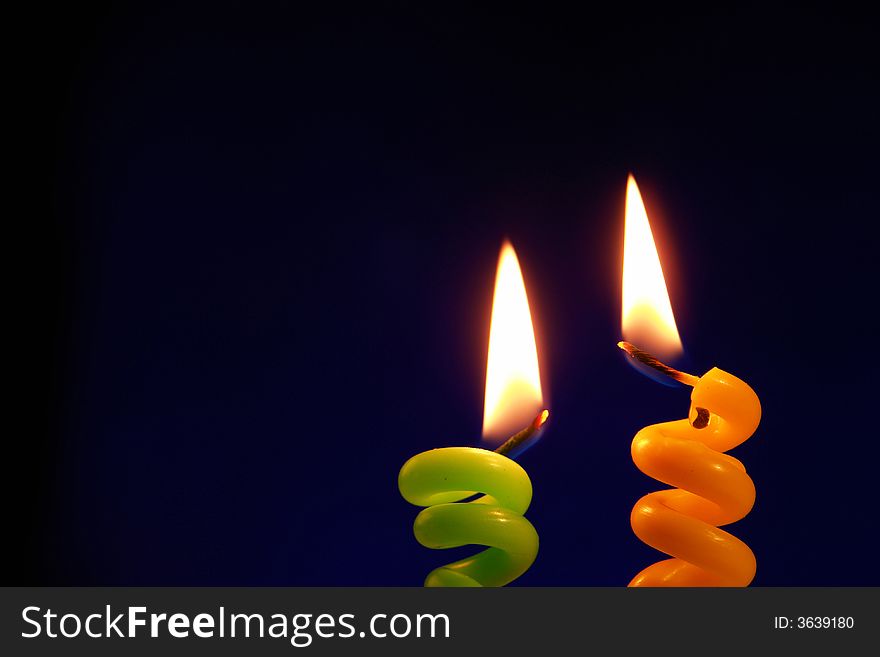 Candle on a black background