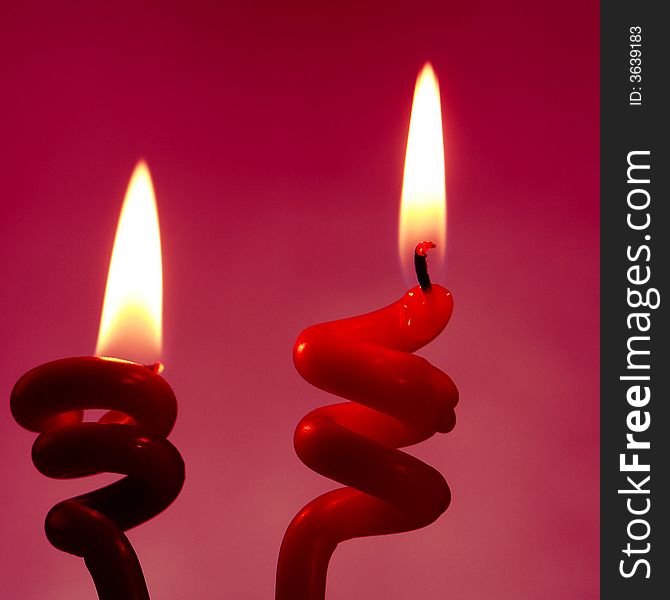 Candle on a red background