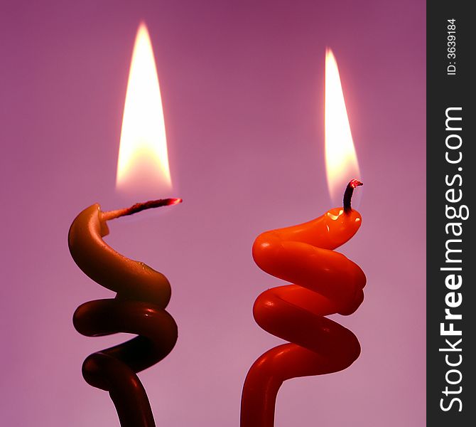 Candle on a violet background