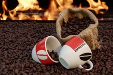 Two Cups Of Espresso And Coffee Beans On A Background Of Fire Stock Photos Two Cups Of Espresso And Coffee Beans On A Background Of Fire Stock Photos