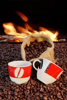 Two Cups Of Espresso And Coffee Beans On A Background Of Fire Stock Photos Two Cups Of Espresso And Coffee Beans On A Background Of Fire Stock Photos