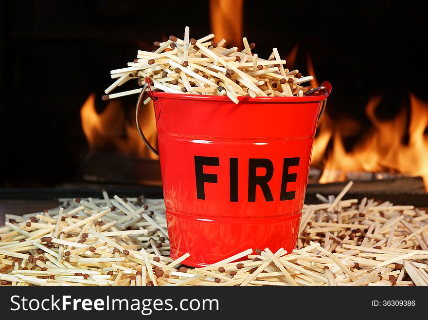 Fire bucket with sign Fire, Flames and matchstick. Fire bucket with sign Fire, Flames and matchstick