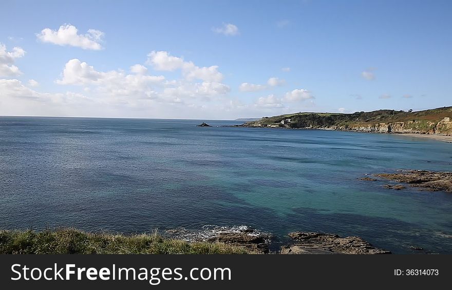 Kenneggy Sand Cornwall England west of Praa Sands and Penzance on the South West Coast Path with blue sky and sea on a sunny day. Kenneggy Sand Cornwall England west of Praa Sands and Penzance on the South West Coast Path with blue sky and sea on a sunny day