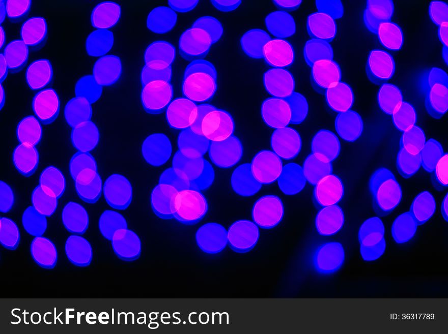 Abstract background of blurred lights with cool blue and purple background with bokeh effect. Abstract background of blurred lights with cool blue and purple background with bokeh effect