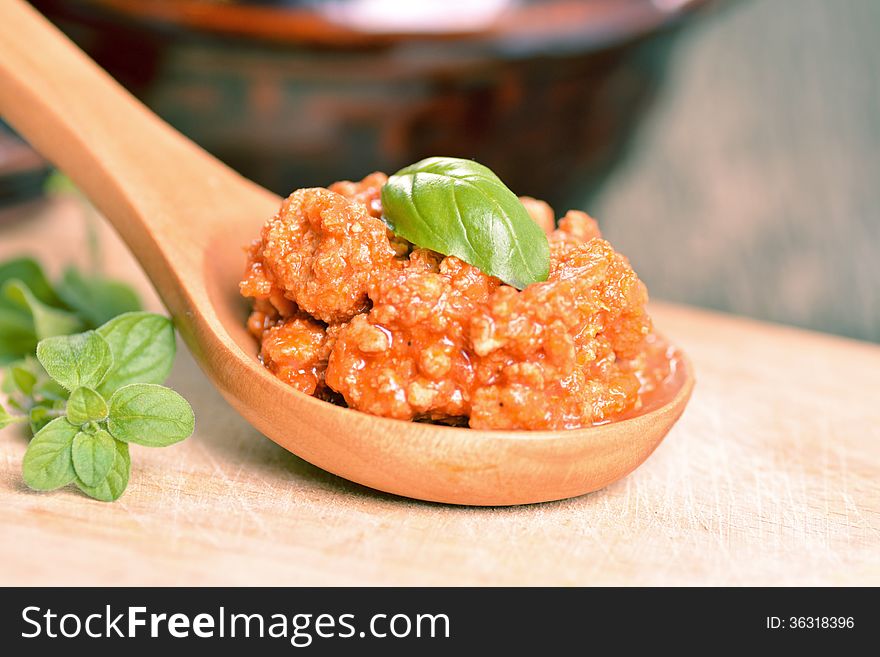 Ragu bolognese on a wooden spoon