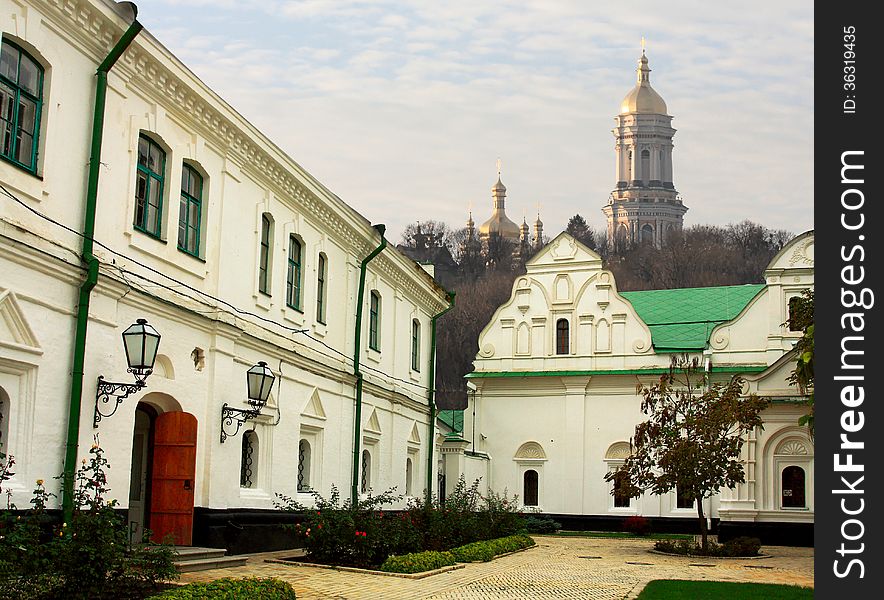 Yard of the orthodox monastery - view of church and belfry outside. Yard of the orthodox monastery - view of church and belfry outside