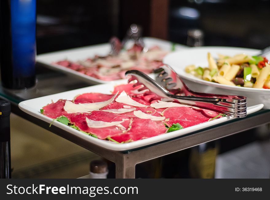 Raw beef carpaccio with parmiggiano