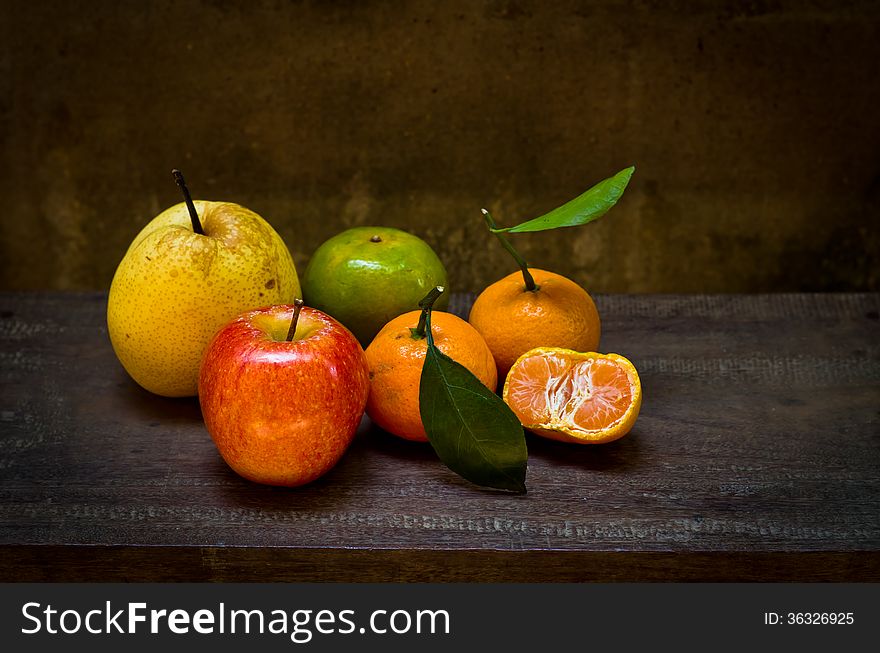 Fresh fruits on an old wood chair,still life