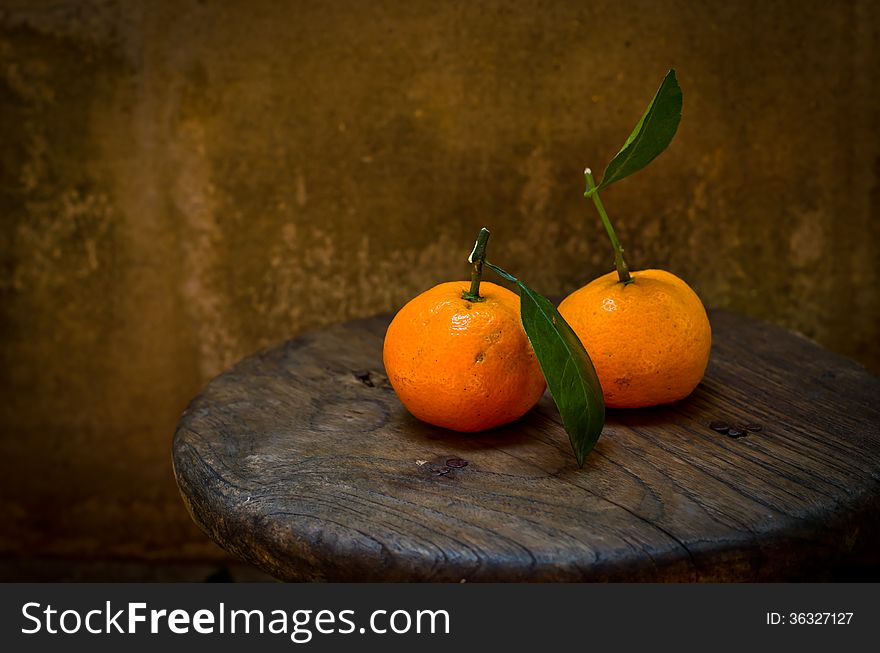 Fresh orange on an old wood table,still life