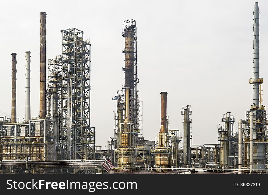 A part of an oil and gas refinery with various petrochemical installations. A part of an oil and gas refinery with various petrochemical installations