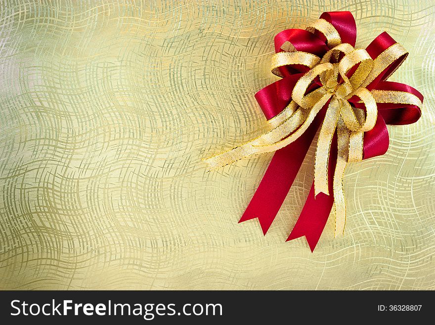 Golden texture on gift box with ribbon. Golden texture on gift box with ribbon