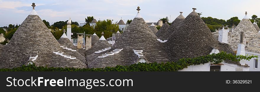 Panorama of Alberobello, Apulia (Italy). Trulli houses, dry-stone houses with conical roofs. From 1996 trulli houses of Alberobello are protected under UNESCO. Panorama of Alberobello, Apulia (Italy). Trulli houses, dry-stone houses with conical roofs. From 1996 trulli houses of Alberobello are protected under UNESCO