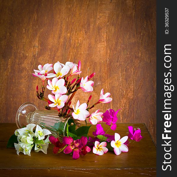 Fresh and colorful flower on wood table,still life