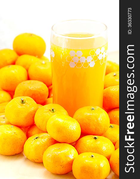 Freshly squeezed orange juice on wood table, selective focus