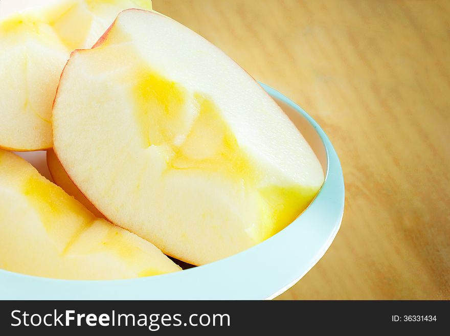 Sweet apple with slice on wood table