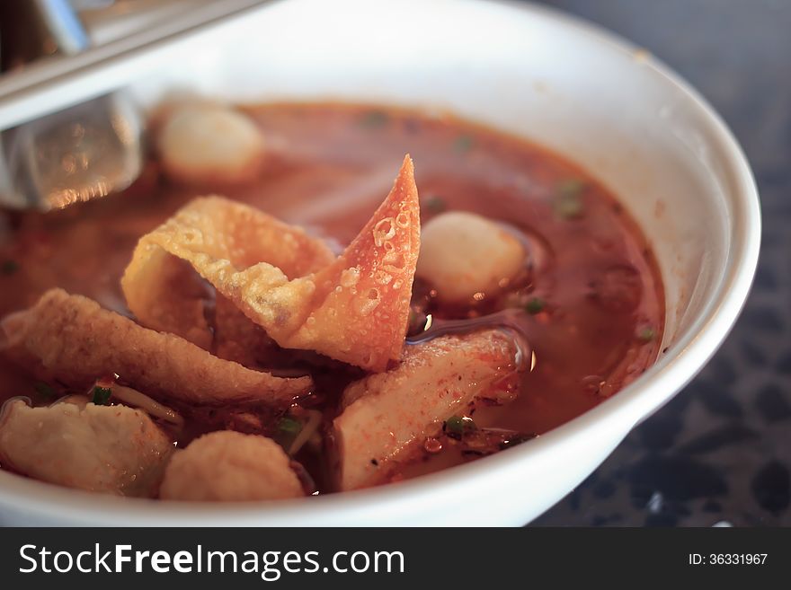 Narrow rice hot spicy noodles with dumpling, select focus