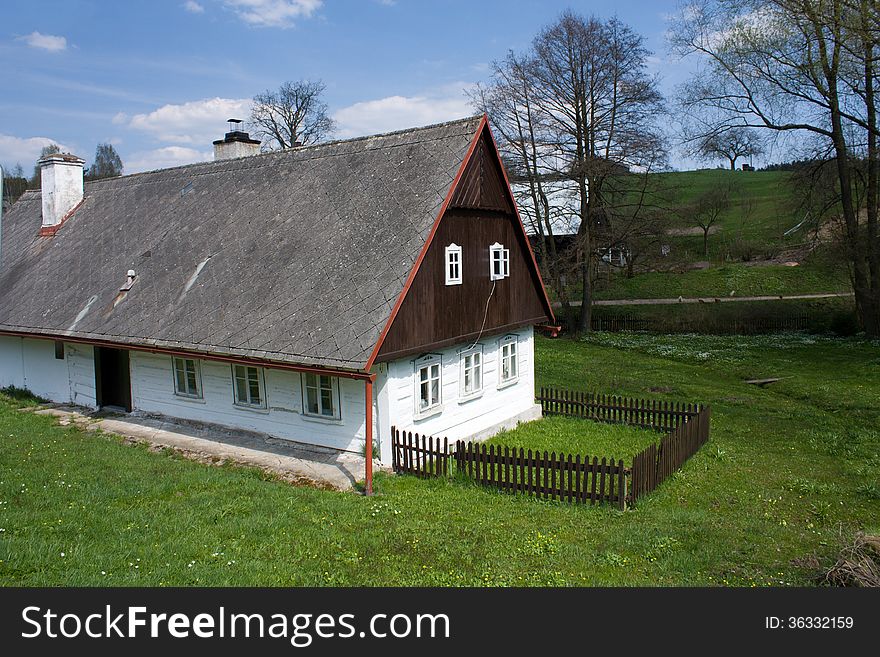 Wooden cottage with a small fence. Wooden cottage with a small fence