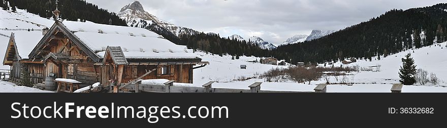 Dolomite mountain and huts panorama