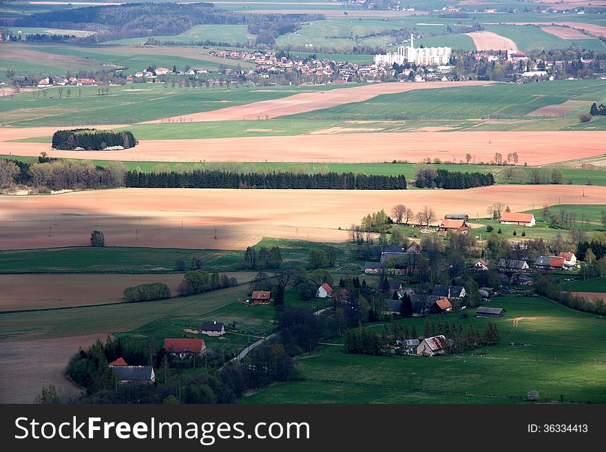 Agricultural landscape and village in the. Agricultural landscape and village in the