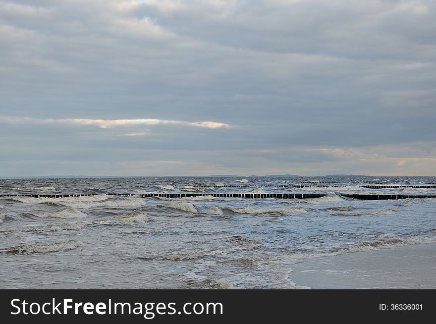 Waves travel to the Baltic Sea beach on the island of Usedom