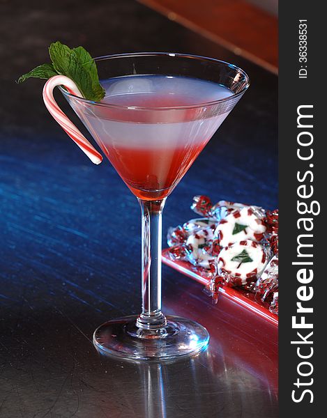 Red cranberry martini with festive Christmas garnish. Red cranberry martini with festive Christmas garnish.