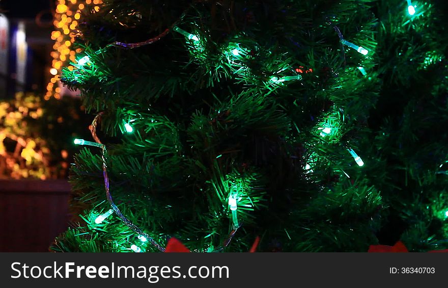 Christmas tree decoration with green light moving. Christmas tree decoration with green light moving