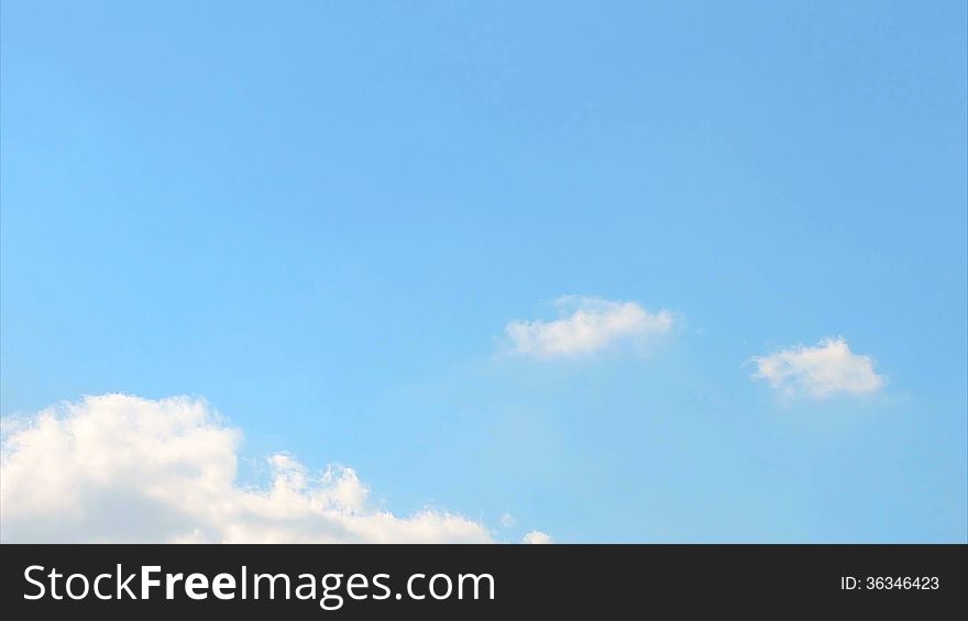 Fast moving white clouds in blue sky timelapse. Fast moving white clouds in blue sky timelapse.