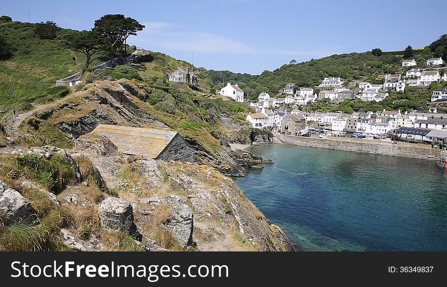 Harbour view in summer Polperro Cornwall England UK during heatwave with blue sky and sea, beautiful Cornish fishing port. Harbour view in summer Polperro Cornwall England UK during heatwave with blue sky and sea, beautiful Cornish fishing port