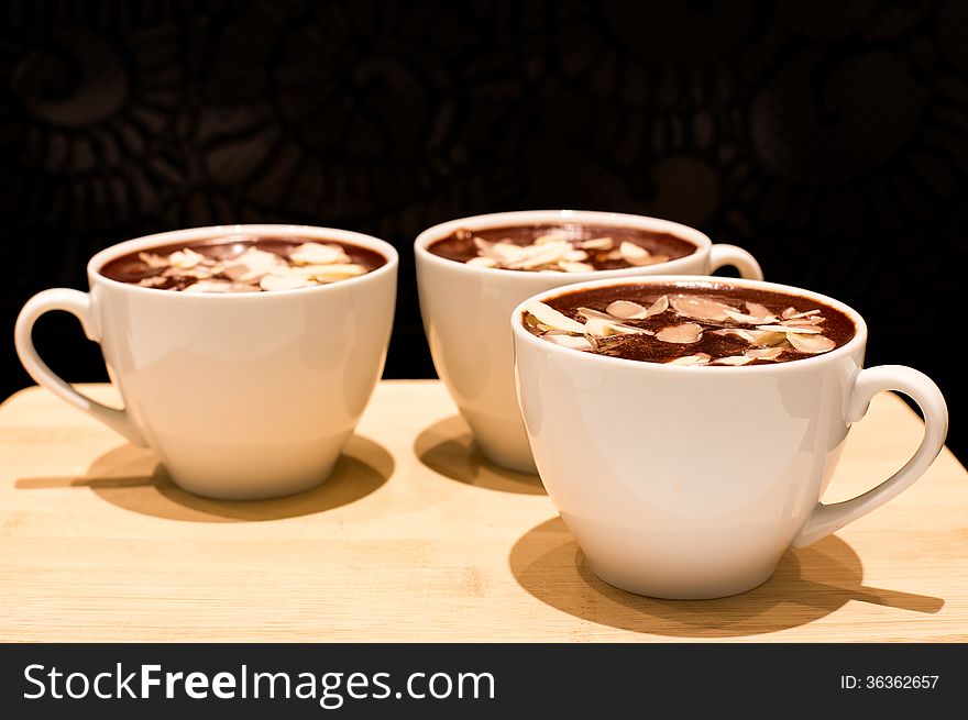 Chocolate mousse with almond in a white cup