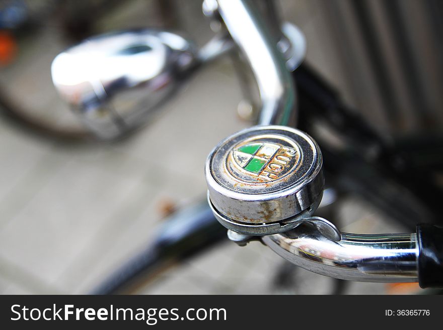 Crome vintage bicycle bell with blurred background
