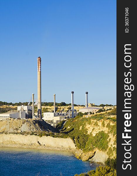 The Maltese power station and the controversial chimney built close to the fishing village of Marsaxlokk