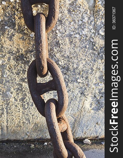 A close up view of a rusted metal chain