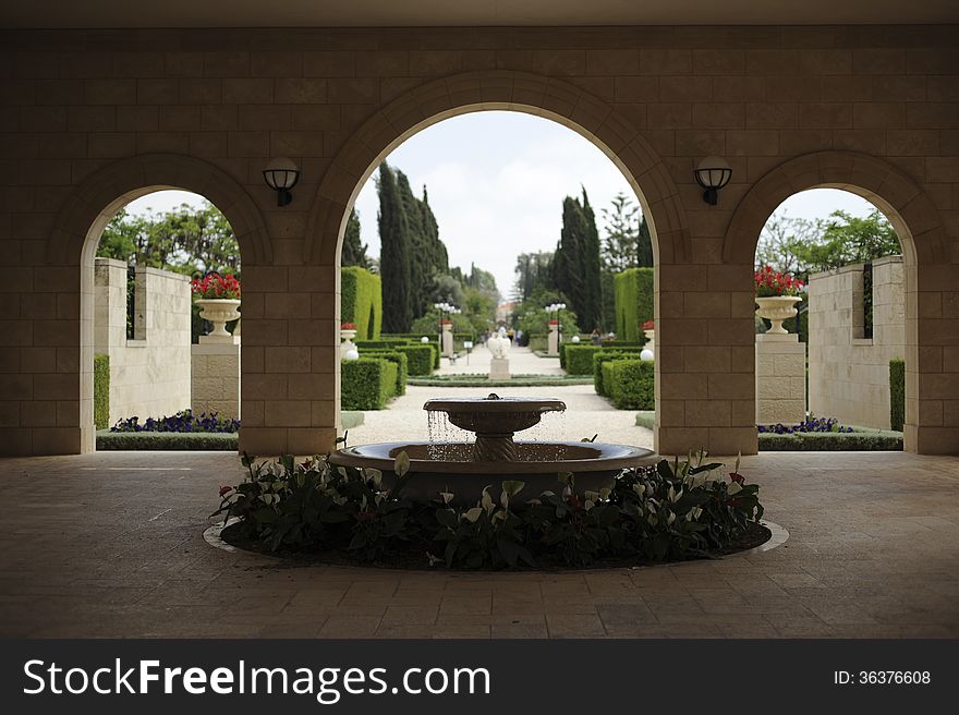 Patio with a fountain and arches in the garden of the Baha'i. Patio with a fountain and arches in the garden of the Baha'i