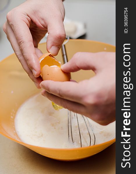 Adding egg to cinnamon bread batter