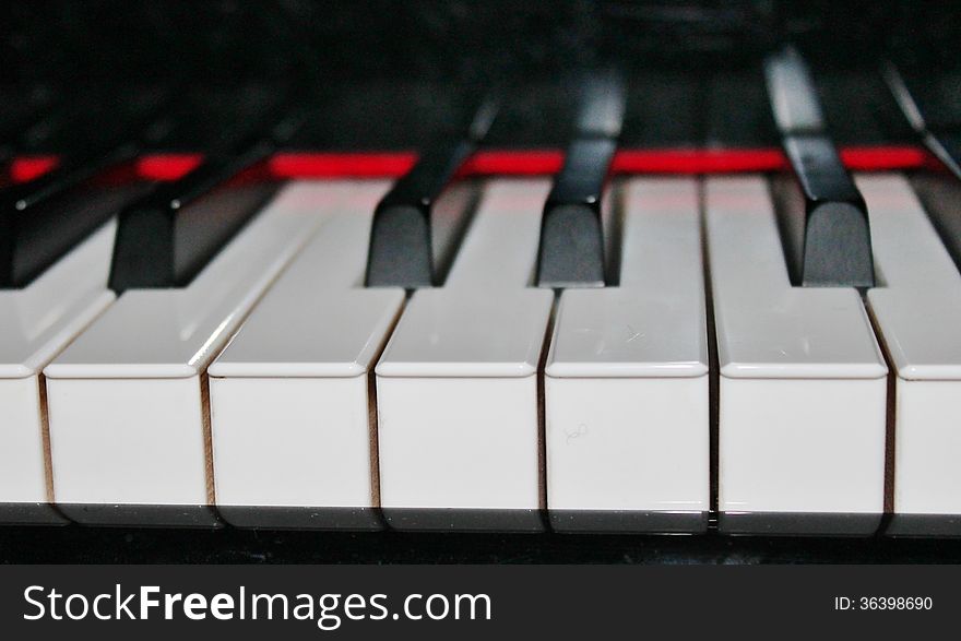 Black and white keys on a acoustic piano. Black and white keys on a acoustic piano