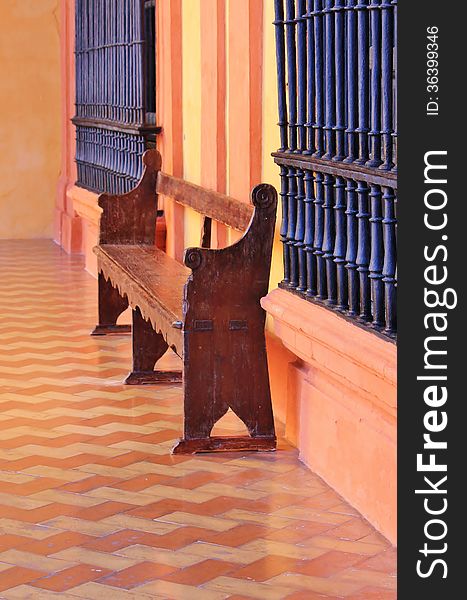 Bench with tiles and orange painted walls. Bench with tiles and orange painted walls